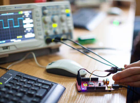 Engineers testing electrical assemblies